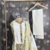 Yellow cotton salwar suit with printed kurta, cotton bottom and cotton dupatta displayed on mannequin in premium studio setup