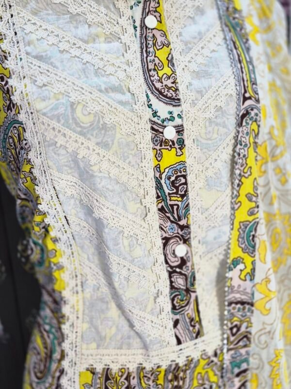 Yellow cotton salwar suit with printed kurta, cotton bottom and cotton dupatta displayed on mannequin in premium studio setup