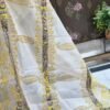 Yellow cotton salwar suit with printed kurta, cotton bottom and cotton dupatta displayed on mannequin in premium studio setup