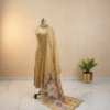 Premium mustard organza embroidered suit set with floral printed dupatta and shantoon bottom displayed in luxury studio setup